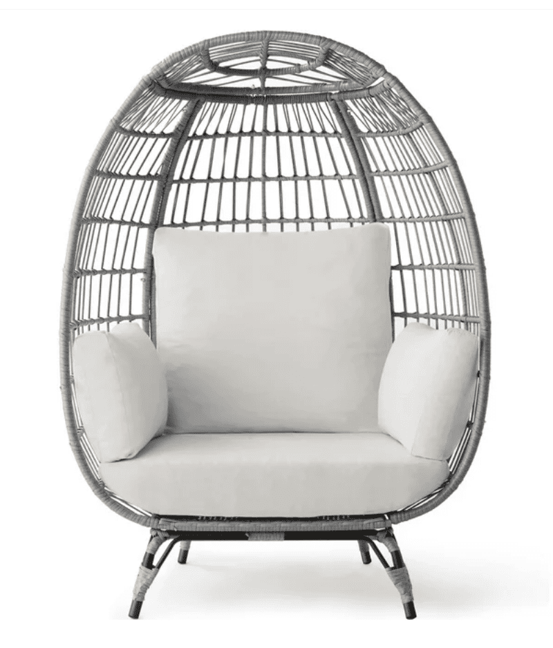 Best-choice-wicker-egg-chairs | Sonia Begonia Gray wicker egg chair with white cushions for outside.