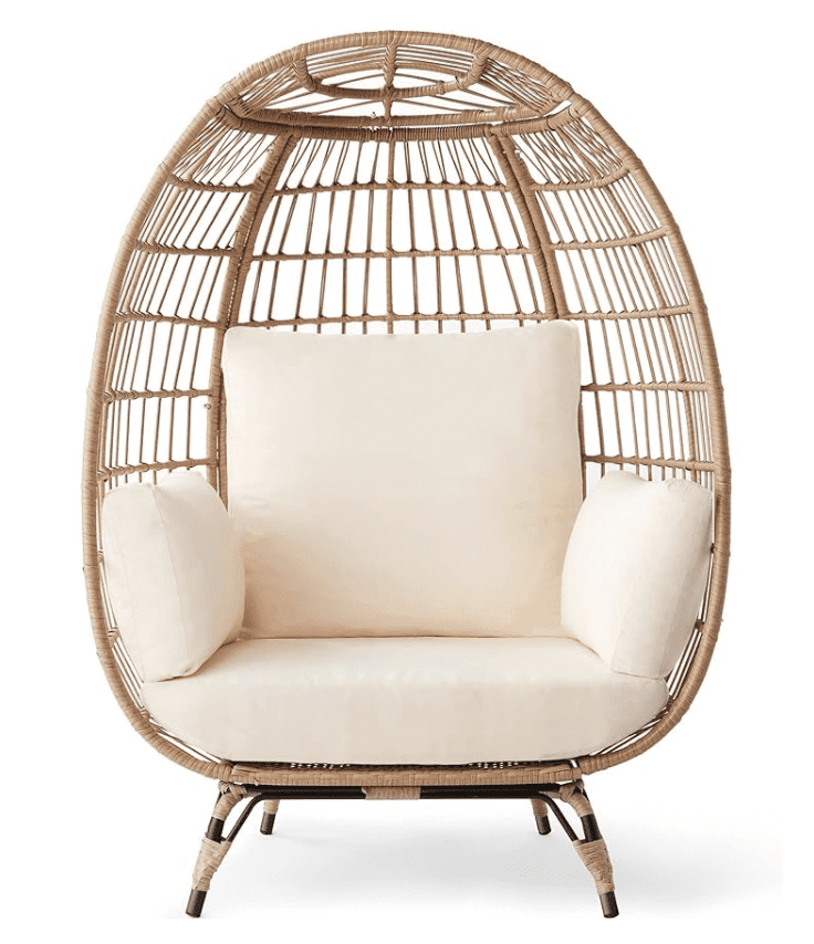 Best-outdoor-egg-chairs | Sonia Begonia Wicker egg chair from Target with white cushions.