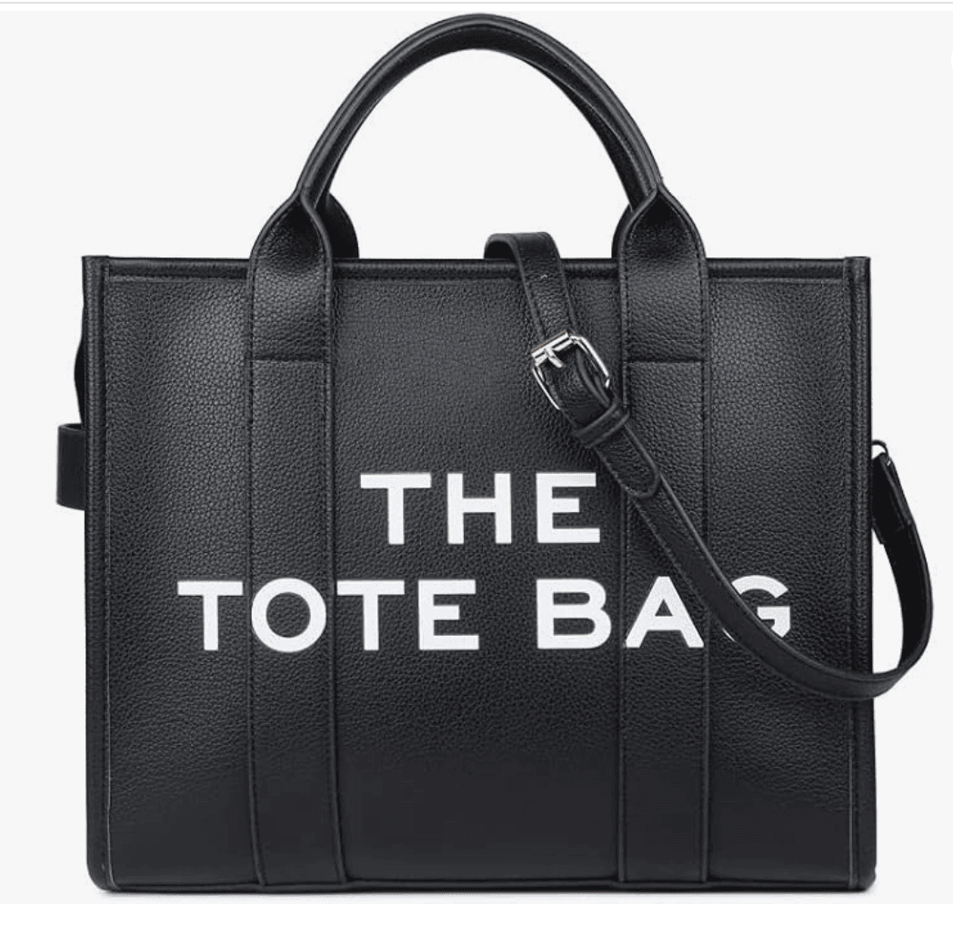 Tote-bag-alternatives | Sonia Begonia Black leather tote bag with two top handles and a detachable shoulder strap; front shows white text 'THE TOTE BAG'.