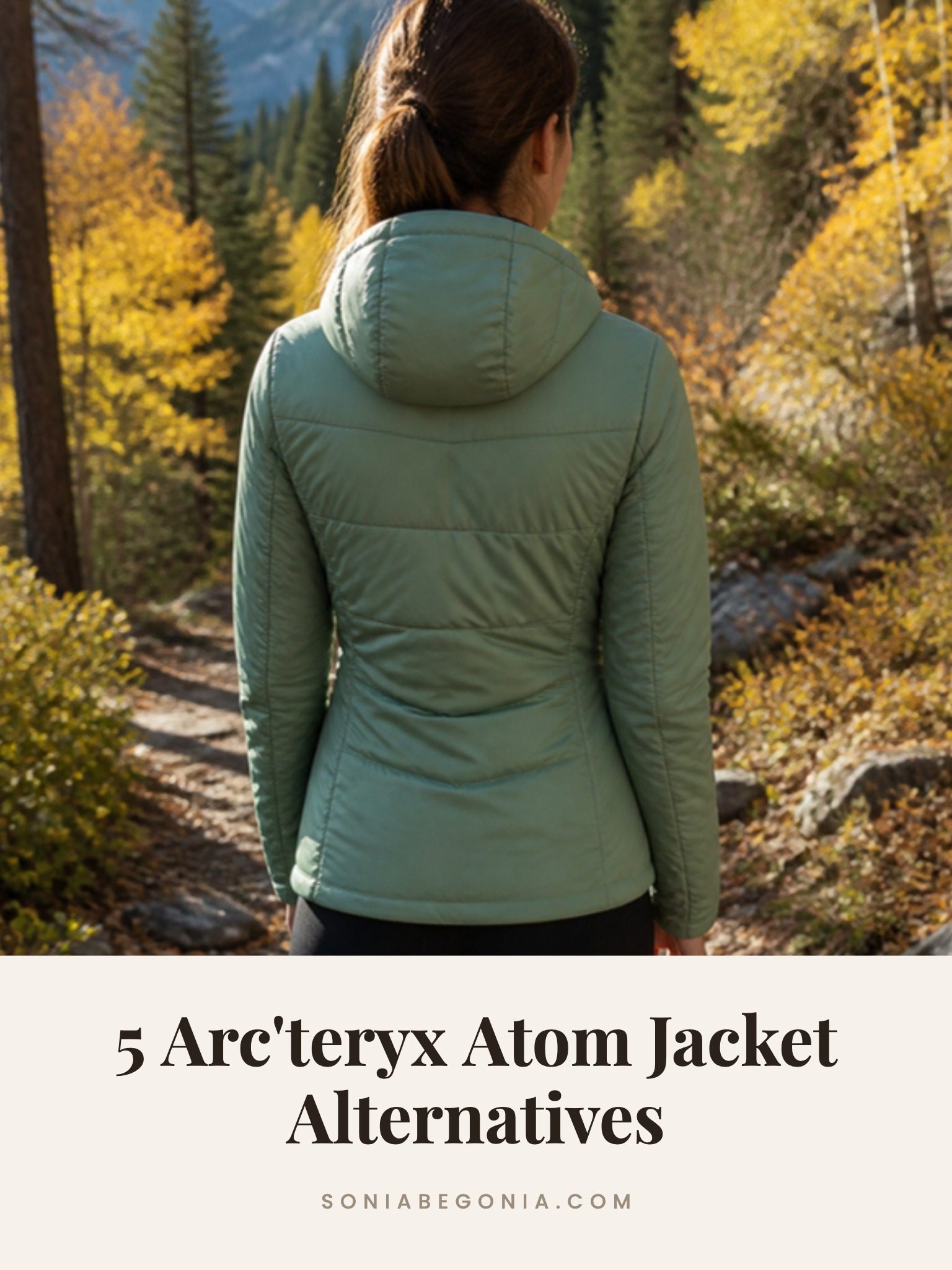 Arc'teryx Atom jacket alternatives: a woman in a green insulated hooded jacket on an autumn hiking trail
