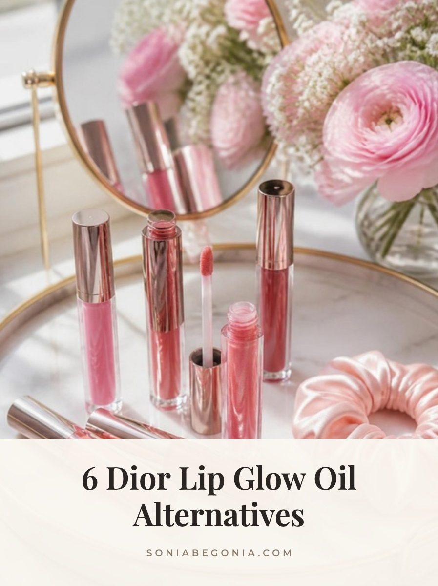 Dior Lip Glow Oil alternatives: pink and rose tinted lip oils on a marble vanity tray with pink flowers and a silk scrunchie