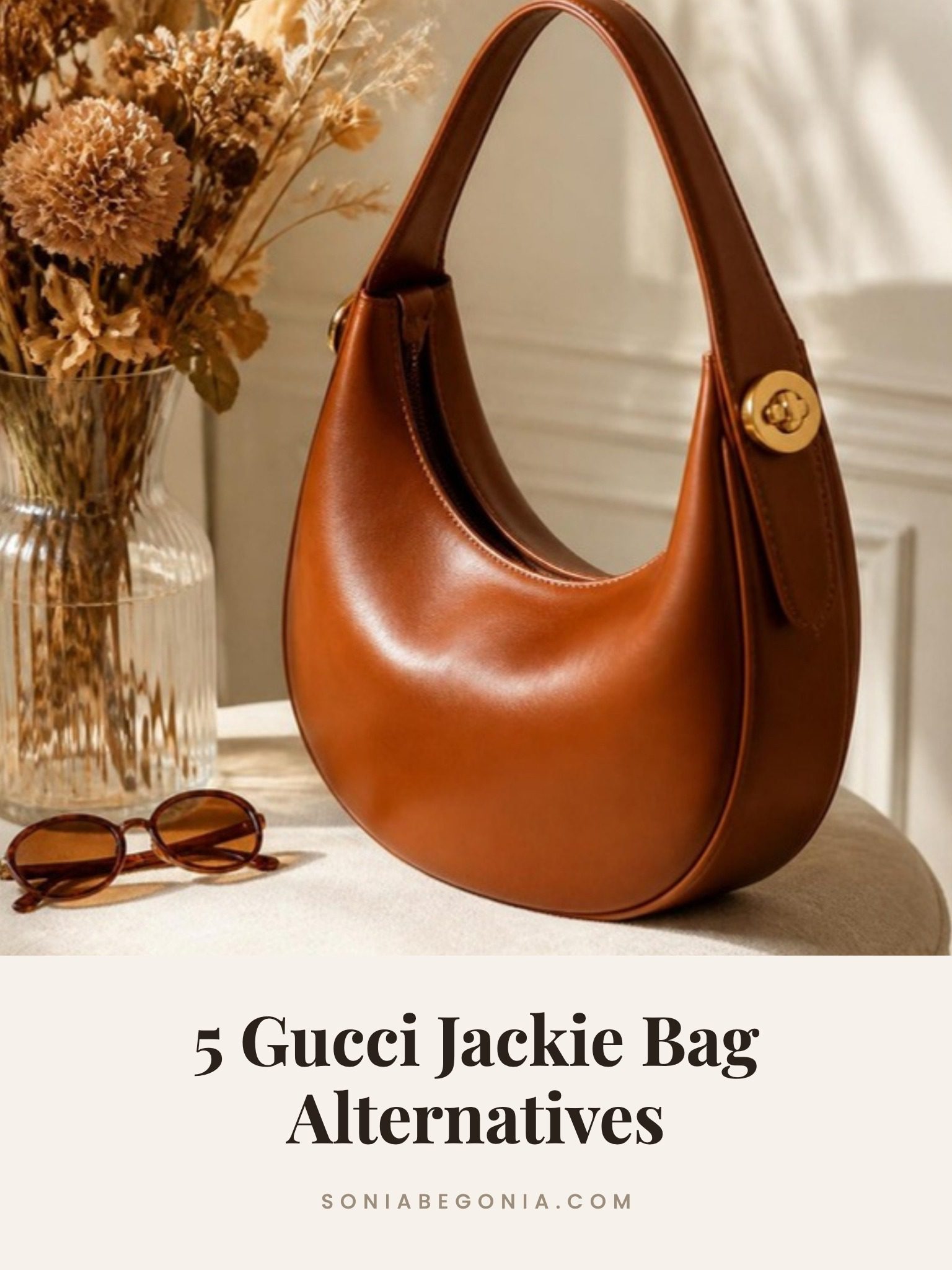 Gucci Jackie bag alternatives: a slouchy crescent hobo shoulder bag on a cafe table
