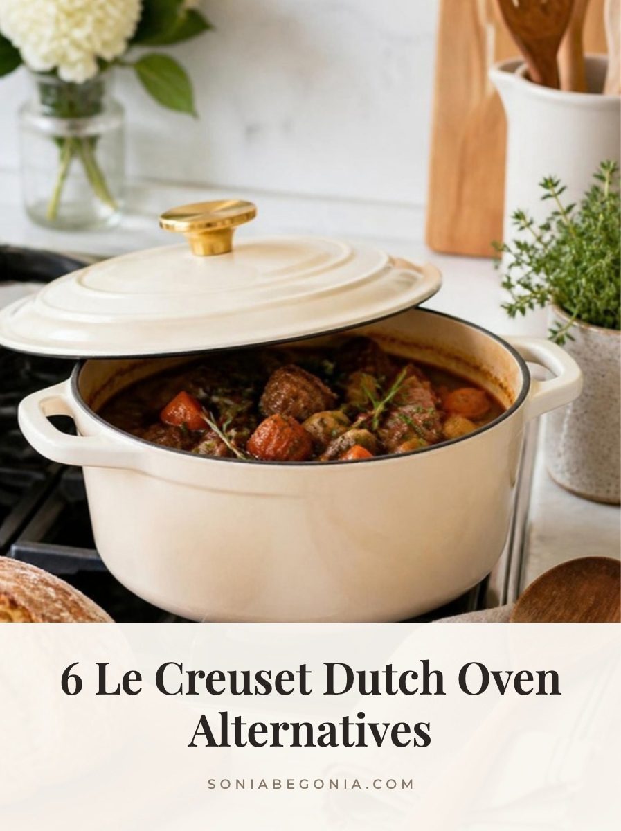 Le Creuset Dutch oven alternatives: cream enameled cast iron Dutch oven with a gold knob and stew on a stovetop with crusty bread and herbs