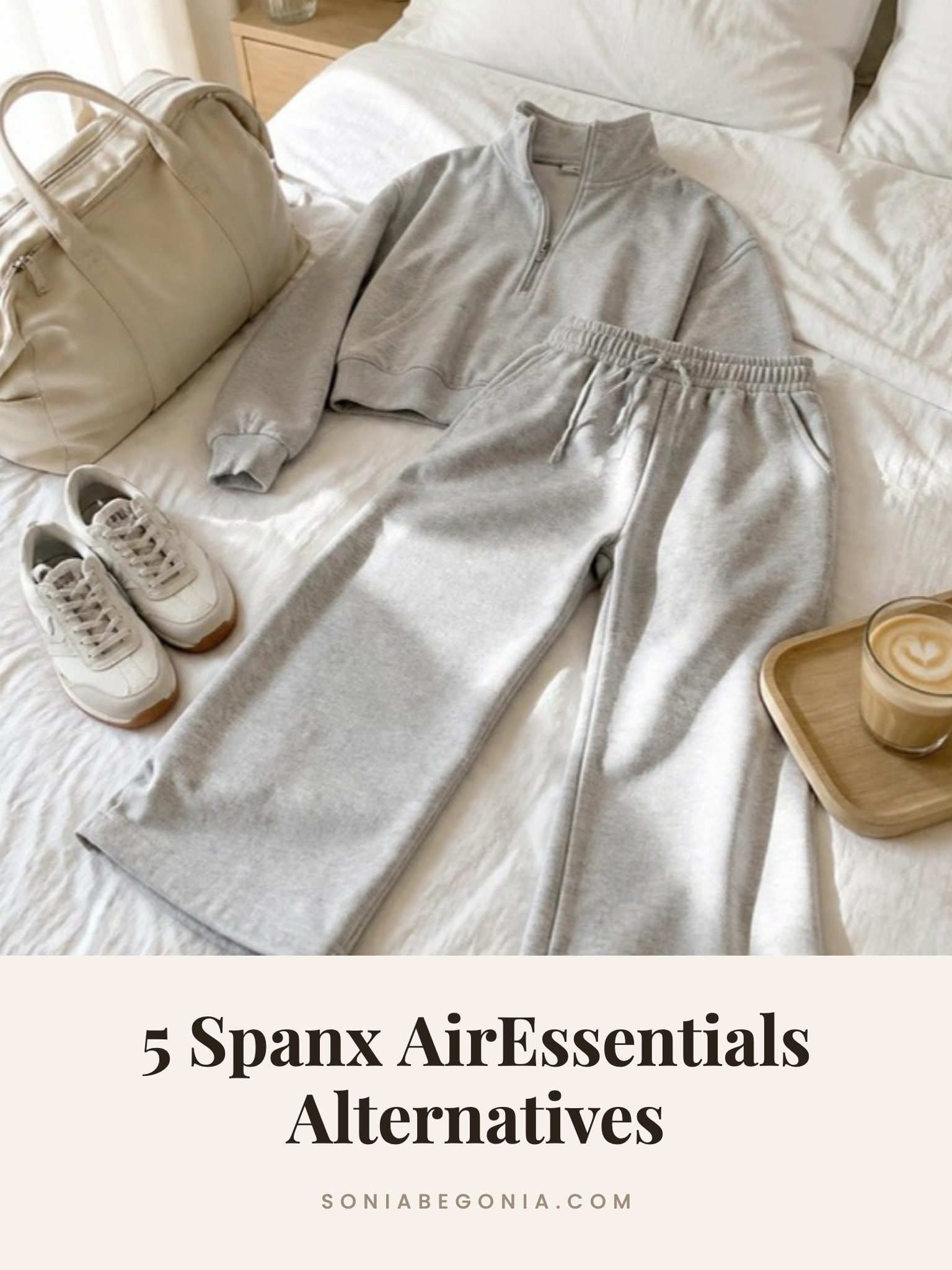 Spanx AirEssentials alternatives: a grey half zip and wide leg lounge set laid on a white bed