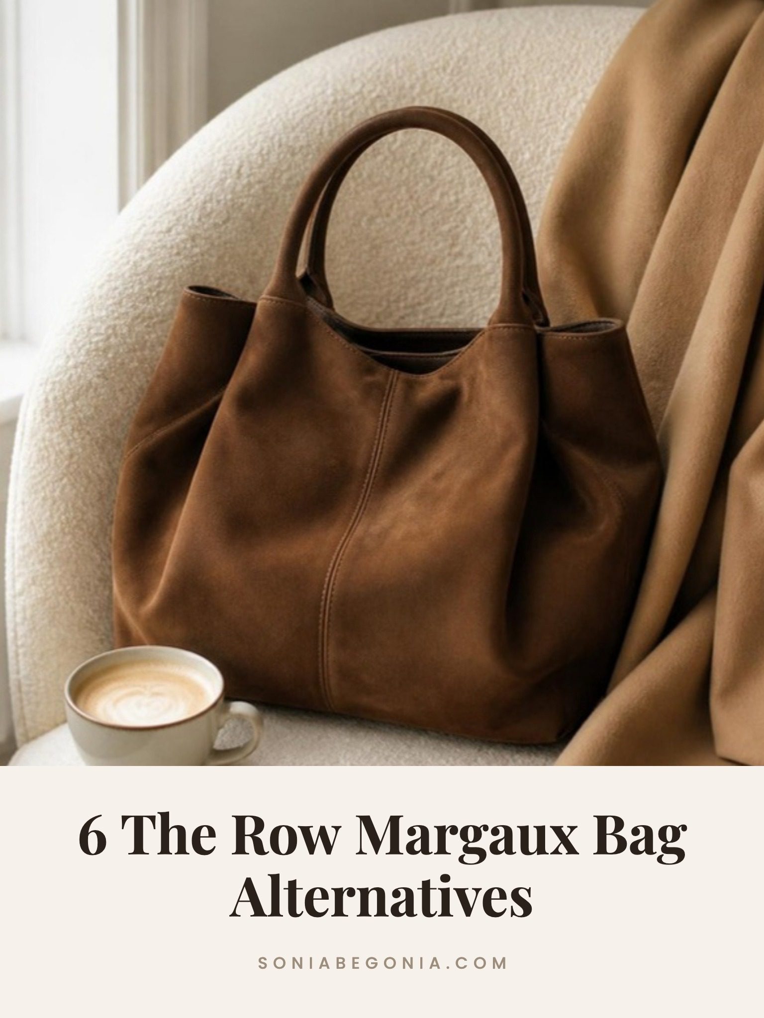 The Row Margaux bag alternatives: slouchy brown suede top handle tote on a cream boucle chair with a latte